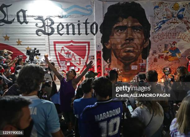 View of an improvised altar set up by Fans of Argentinos Juniors' football team, where Argentinian football legend Diego Maradona used to play,...