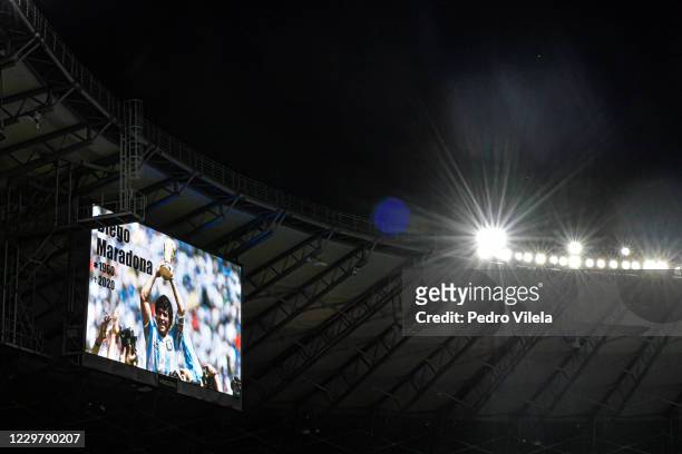 The stadium's screen displays a memorial message for the late Argentine football legend Diego Maradona during a minute of silence before the match...