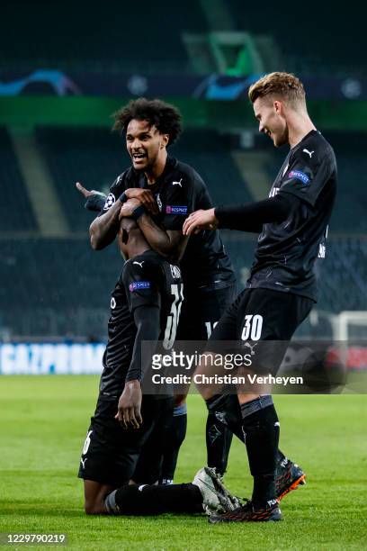 Breel Embolo of Borussia Moenchengladbach celebrate with teammates after he score his teams third goal during the Group B - UEFA Champions League...