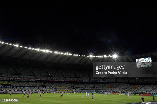 Players of Botafogo and Atletico Mineiro observe a minute of silence for the late Argentine football legend Diego Maradona before the match between...