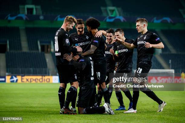 Breel Embolo of Borussia Moenchengladbach celebrate with teammates after he score his teams third goal during the Group B - UEFA Champions League...