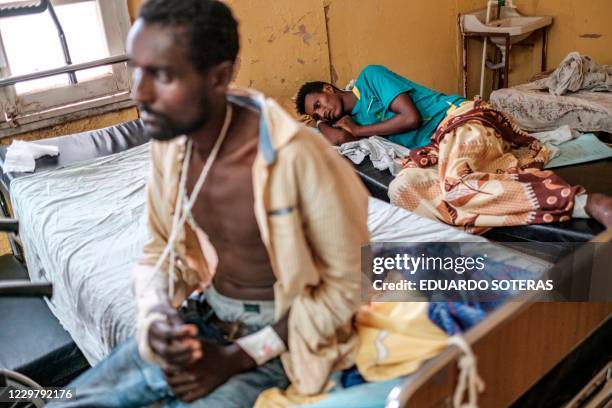 This November 20, 2020 photograph shows survivors of the November 9, 2020 Mai Kadra massacre, recovering at the Gondar University Hospital, in the...