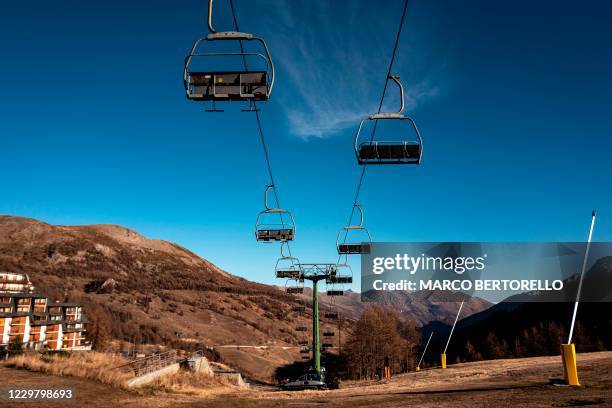 Deserted chairlift is pictured at the alpine ski resort of Sestriere in Val Susa, Piedmont, Italy, on November 26, 2020 during the COVID-19 pandemic...