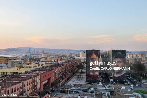 General view shows a mural of late Argentinian football legend Diego Maradona on November 26, 2020 in Naples. Maradona, widely remembered for his...