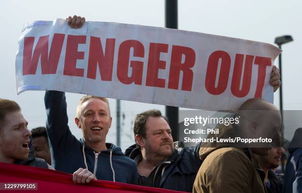 Arsenal fans outside the ground protest against manager Arsene Wenger and owner Stan Kroenke before the Barclays Premier League match between Arsenal...