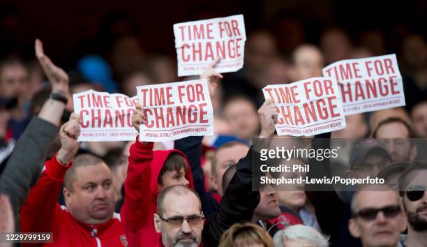 Arsenal fans protest against manager Arsene Wenger and owner Stan Kroenke during the Barclays Premier League match between Arsenal and Norwich City...