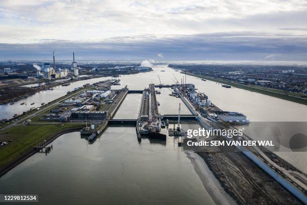 An aerial picture taken on November 27, 2020 shows the IJmuiden Sea Lock, the world's largest sea lock in IJmuiden, on November 27, 2020. /...