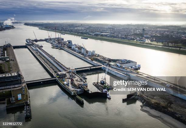 An aerial picture taken on November 27, 2020 shows the IJmuiden Sea Lock, the world's largest sea lock in IJmuiden, on November 27, 2020. /...