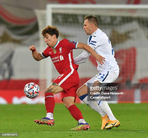 Liverpool's Kostas Tsimikas battles with Atalanta's Josip Ilicic during the UEFA Champions League Group D stage match between Liverpool FC and...