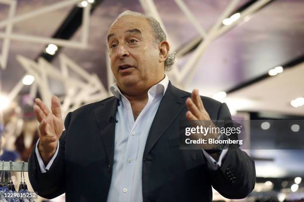 Philip Green, the billionaire owner of fashion retailer Arcadia Group Ltd., gestures during a Bloomberg Television interview inside a Topshop store...