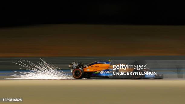 McLaren's British driver Lando Norris drives during the second practice session ahead of the Bahrain Formula One Grand Prix at the Bahrain...