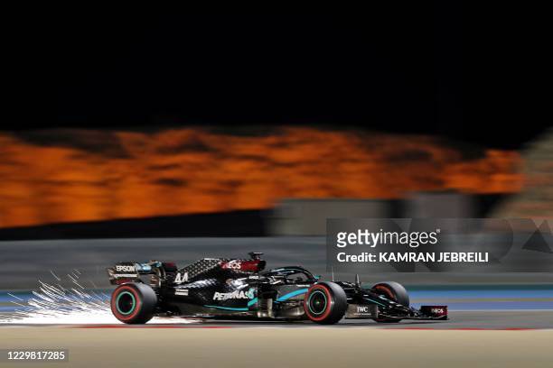 Mercedes' British driver Lewis Hamilton drives during the second practice session ahead of the Bahrain Formula One Grand Prix at the Bahrain...