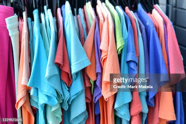 Rack of t-shirts is displayed for sale on a sidewalk outside a store during Black Friday on November 27, 2020 in Rehoboth Beach, Delaware. Due to the...