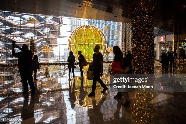 Shoppers wearing protective masks are seen at Hudson Yards on November 27, 2020 in New York, United States. Shoppers go out early despite ongoing...