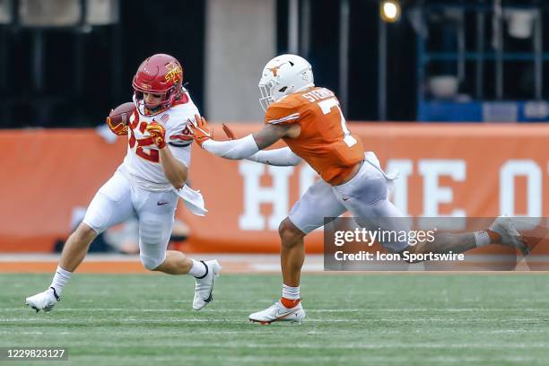 Iowa State Cyclones wide receiver Landen Akers catches a pass and turns upfield avoiding Texas Longhorns defensive back Caden Sterns during the game...