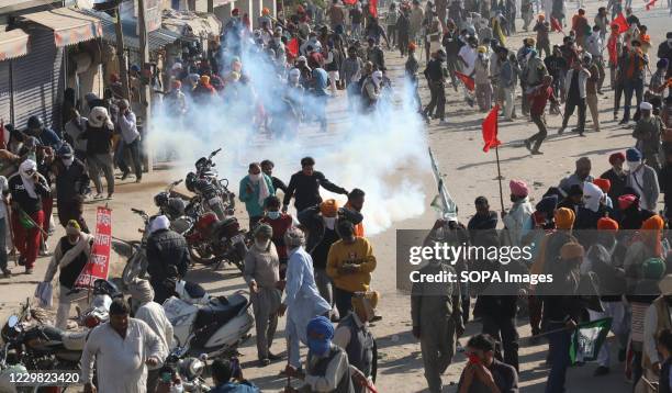 Police force firing tear gas to disperse protesters during the demonstration. Groups of farmers marched from Singhu border Delhi-Haryana border...