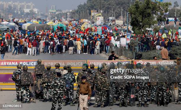 Police stand on guard during the demonstration. Groups of farmers marched from Singhu border Delhi-Haryana border towards New Delhi demonstrating...