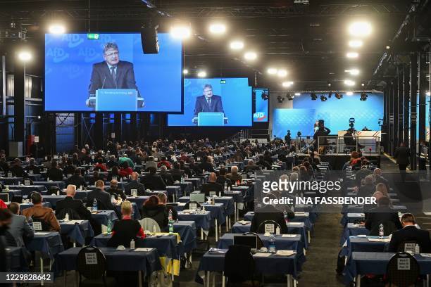 Joerg Meuthen, Co-leader of the AFD, is seen on video screens during his speech at the Party Congress of farright AfD party at the Wunderland Kalkar,...