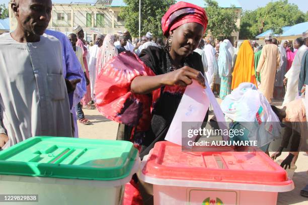 Woman casts her ballots for the local elections at a polling station at the Mafoni Internal Displaced People camp near Maiduguri on November 28, 2020.