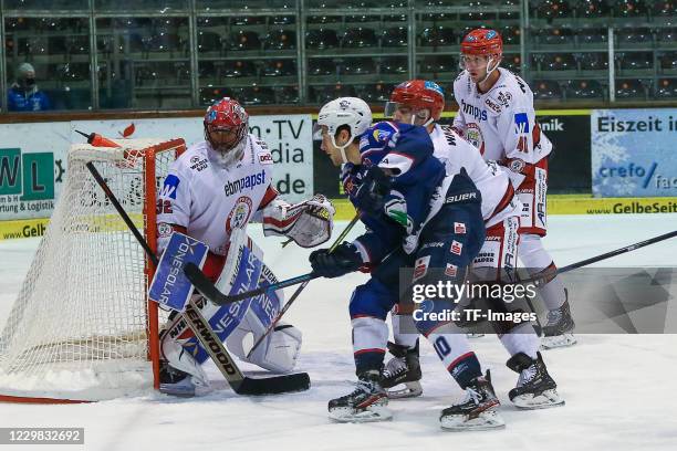 Dimitri Paetzold of EV Landshut and Brett Cameron of EC Kassel Huskies battle for the ball during the DEL2 Ice Hockey League between Kassel Huskies...