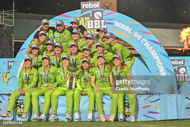 Rachael Haynes of the Thunder lifts the trophy as the Thunder celebrate victory during the Women's Big Bash League Final between the Melbourne Stars...