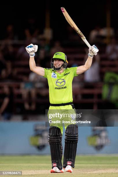 Heather Knight of the Sydney Thunder hit the winning runs and celebrates during the Women's Big Bash League final cricket match between Melbourne...