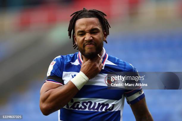 Liam Moore of Reading reacts after taking a blow to the throat during the Sky Bet Championship match between Reading and Bristol City at Madejski...