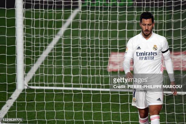 Real Madrid's Belgian forward Eden Hazard leaves the pitch during the Spanish League football match between Real Madrid and Deportivo Alaves at the...
