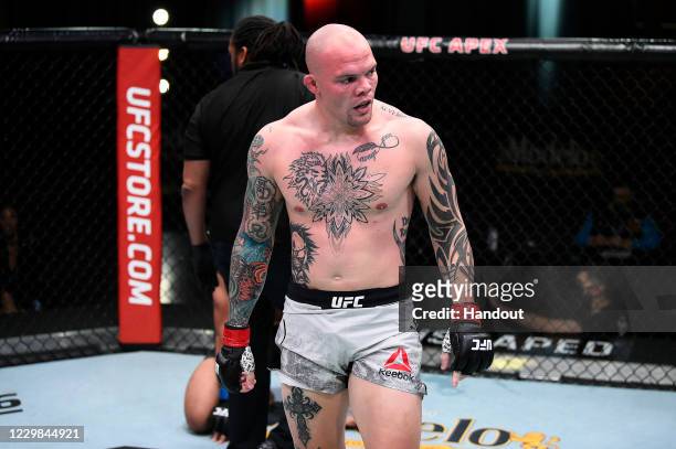 In this handout image provided by the UFC, Anthony Smith reacts after submitting Devin Clark in their light heavyweight bout during the UFC Fight...