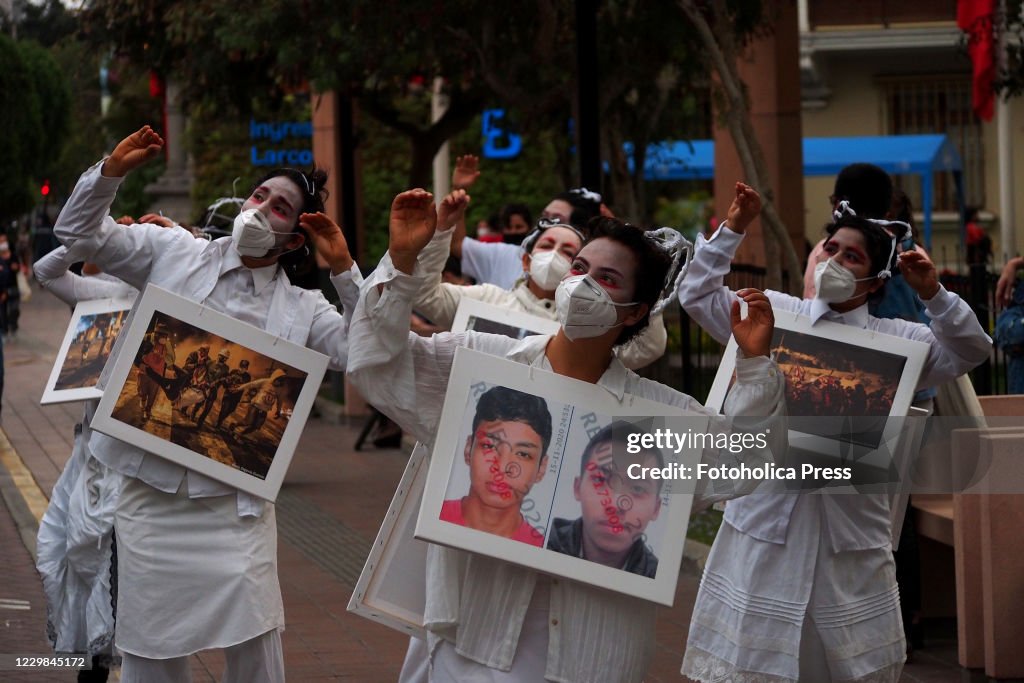 Women in white, carrying a picture of the marches where two...