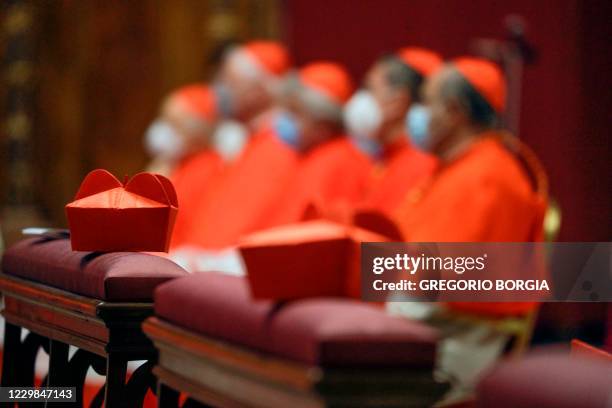 Cardinals' biretta hats are pictured during a Pope's Mass with new cardinals on November 29, 2020 at St. Peter's basilica in The Vatican. - Pope...