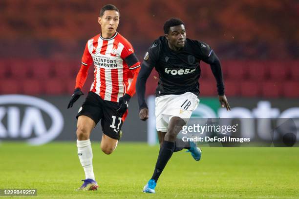 Mauro Junior of PSV Eindhoven, Moussa Wague of Paok Saloniki looks on during the UEFA Europa League Group E stage match between PSV Eindhoven and...