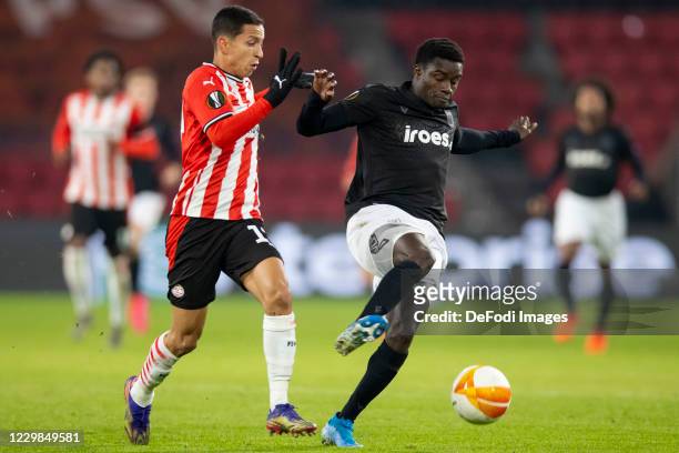 Mauro Junior of PSV Eindhoven, Moussa Wague of Paok Saloniki Battle for the ball during the UEFA Europa League Group E stage match between PSV...