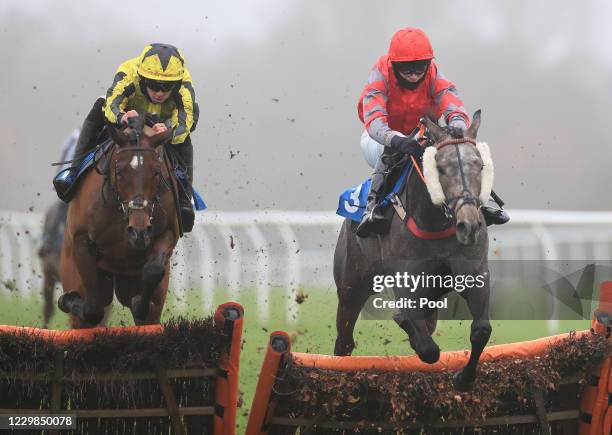 Blue Slate ridden by Paul O'Brien jumps ahead of Opine to win the Bring Home The Jumps On Racing TV Juvenile Maiden Hurdle at Leicester Racecourse on...