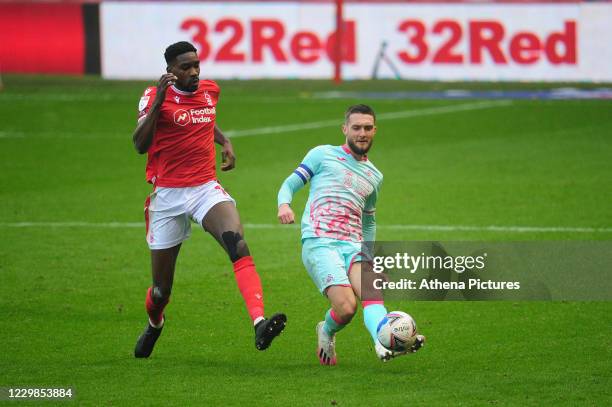 Sammy Ameobi of Nottingham Forest vies for possession with Matt Grimes of Swansea City during the Sky Bet Championship match between Nottingham...