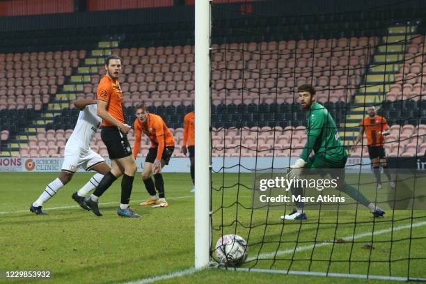 Cameron Jerome of MK Dons scores the winning goal during the Emirates FA Cup Second Round match between Barnet FC and Milton Keynes Dons at The Hive...