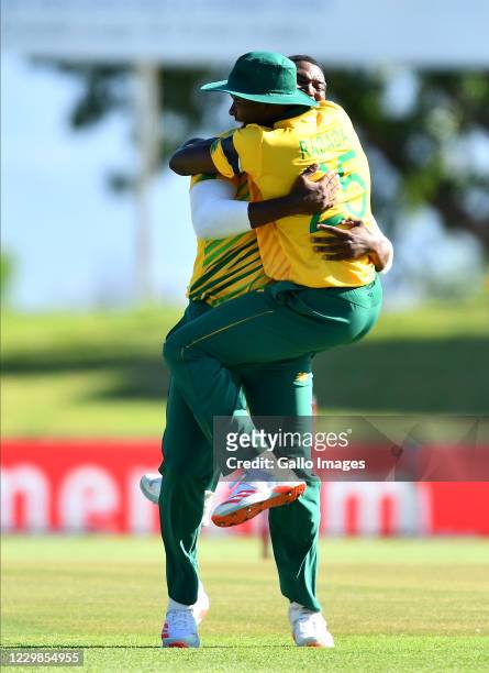 Lungi Ngidi celebrates with Kagiso Rabada of South Africa after dismissing Jason Roy of England during the 2nd KFC T20 International match between...