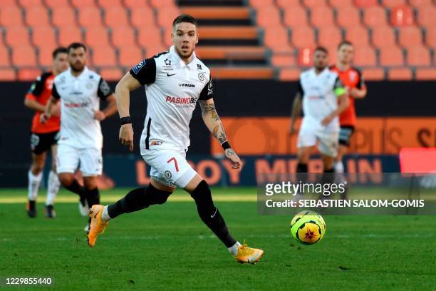Montpellier's Bosnia and Herzegovina defender Mihailo Ristic runs with the ball during the L1 football match between Lorient and Montpellier at the...