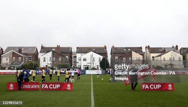 Marine and Havant And Waterlooville head out to the pitch to line up before the Emirates FA Cup second round match at Rossett Park, Crosby.