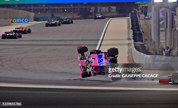Racing Point's Canadian driver Lance Stroll crashes during the Bahrain Formula One Grand Prix at the Bahrain International Circuit in the city of...