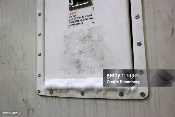 Dry ice on an Envirotainer AB refrigerated shipping container access hatch in the Deutsche Lufthansa AG Cargo Cool Center at Frankfurt Airport in...