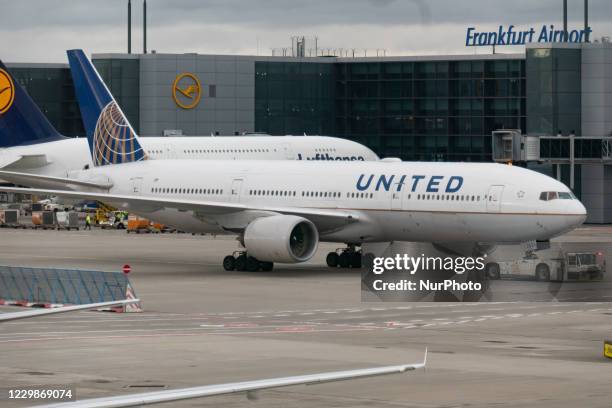 United Airlines Boeing 777 aircraft as seen in Frankfurt Airport FRA towed and taxiing to depart for a transatlantic flight to the United States. The...