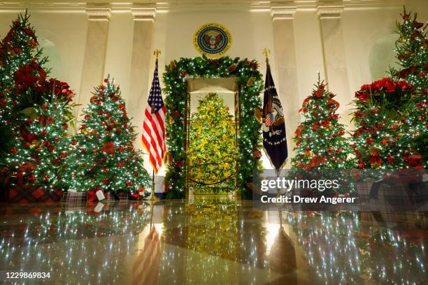 Christmas decorations are on display in the Cross Hall and Blue Room of the White House on November 30, 2020 in Washington, DC. This year's theme for...