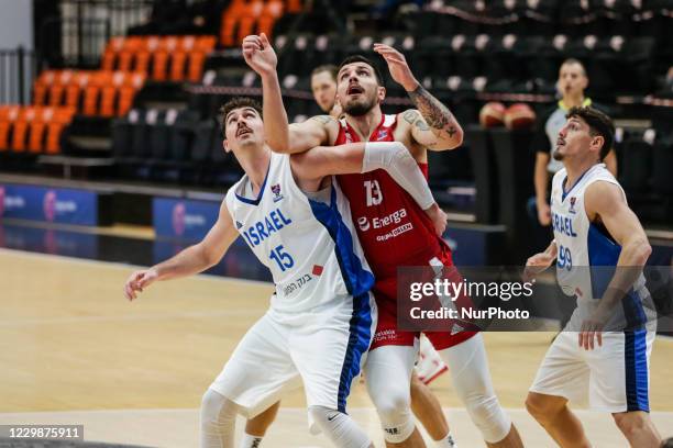 Dominik Olejniczak of Poland and 15 Jake Cohen of Israel during the FIBA EuroBasket 2022 Qualifiers match of group A between Israel and Poland at...