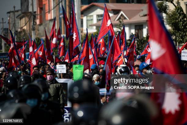 Hundreds of Nepalese people with national flag seen during a pro-monarchy demonstration. Pro-monarchy protesters gathered in Kathmandu asking for the...