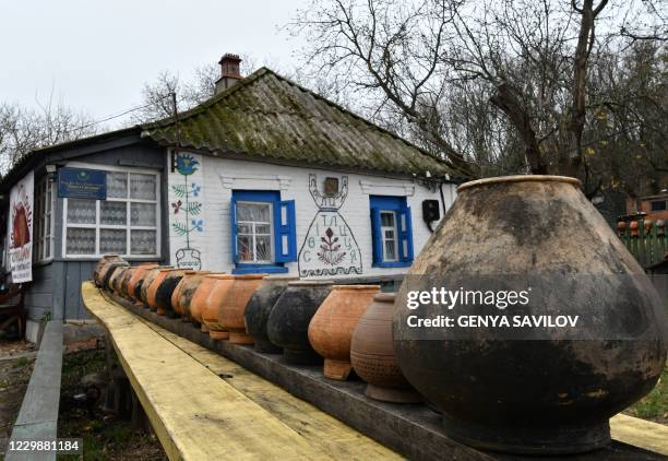 This picture shows traditional clay pots in the house yard of Olena Shcherban, Ukrainian ethnologist and historian, who studies borscht and has 365...