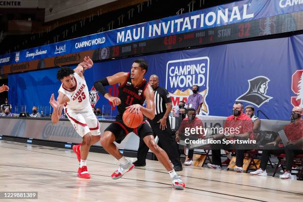Stanford Cardinal forward Jaiden Delaire is guarded by Alabama Crimson Tide forward James Rojas in the first half during the first round of the...