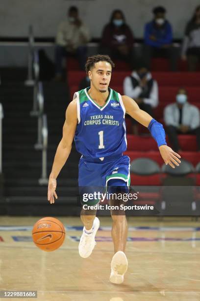 Texas A&M-CC Islanders guard Jordan Hairston brings the ball up court during the game between SMU and Texas A&M - Corpus Christi on November 30, 2020...