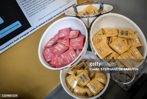 Photo shows condoms displayed at the Paris' CheckPoint prevention and screening centre in Paris, on December 1, 2020. - The centre offers a sexual...