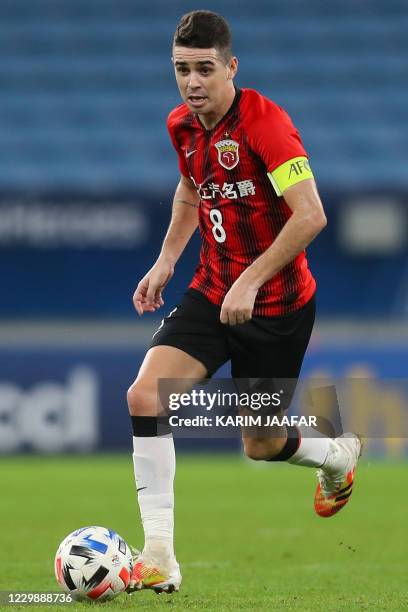 S midfielder Oscar runs with the ball during the AFC Champions League group H football match between China's Shanghai SIPG and Australia's Sydney FC...